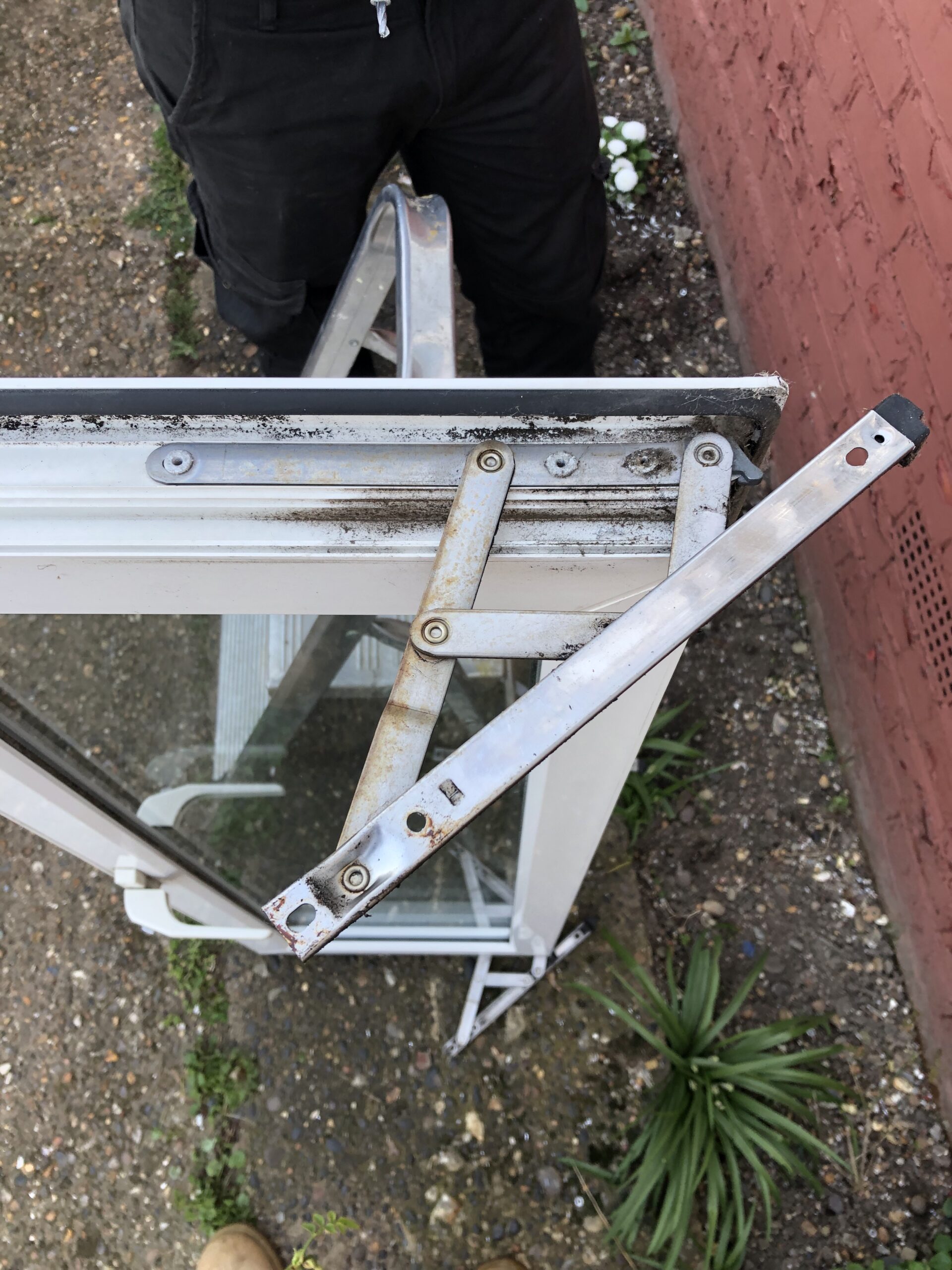 Replacement of window hinges Erith BEFORE, see below for after